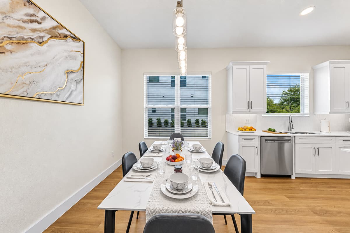 Dining area with open flow into kitchen, creating a warm and inviting space.