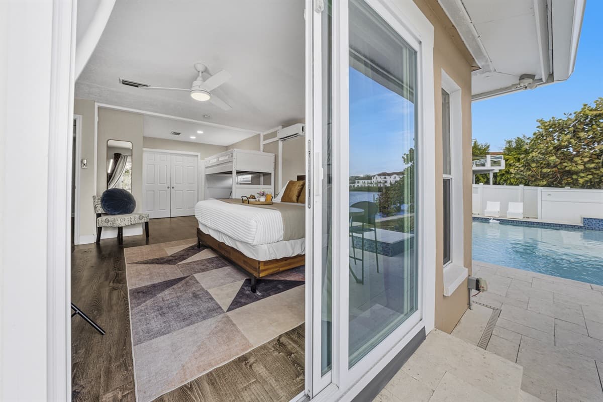 Step directly from the bedroom to the patio and enjoy peaceful waterfront views.