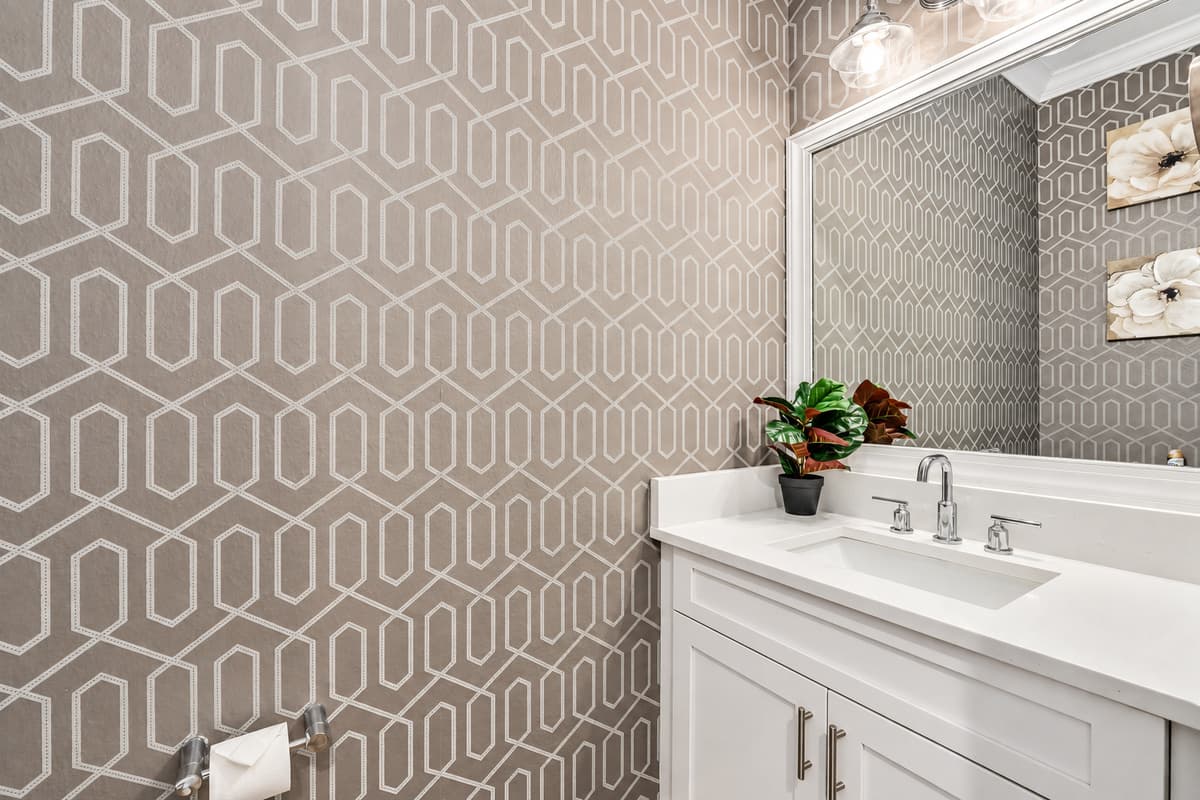 This half bathroom is perfect for guests who need a quick and convenient space to freshen up. 