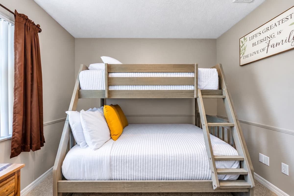 The bunk bed provides flexible sleeping arrangements, making this room an excellent choice for visiting family or friends.