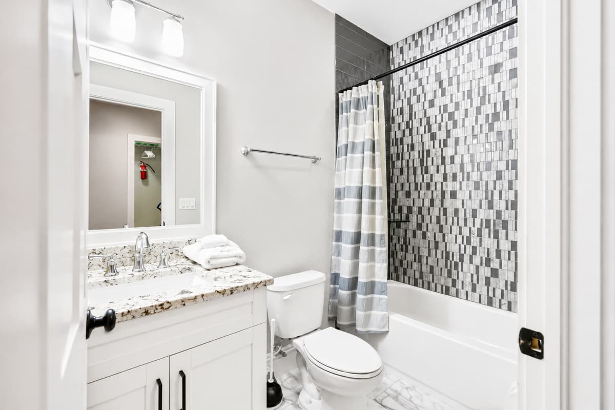 Clean and spacious with a shower/tub combination, granite countertops, and complimentary starter toiletries.