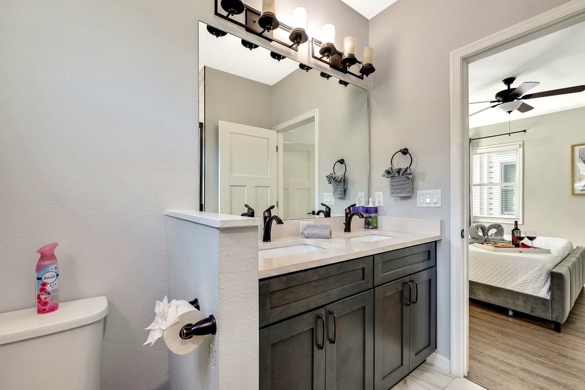 The ensuite bathroom is a masterpiece of design and functionality, offering a private oasis within the suite.