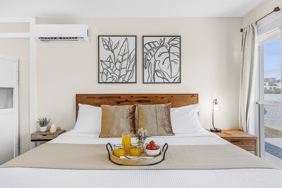 Comfortable king bedroom with stylish décor and convenient bunk beds for kids.