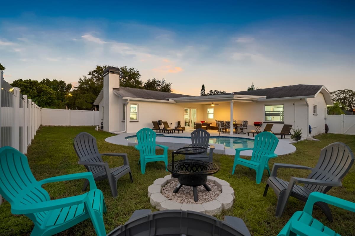 Enjoy a private retreat with everything you need — a sparkling pool, outdoor dining area, and fire pit circle perfect for evening gatherings. The ideal space to unwind and connect.