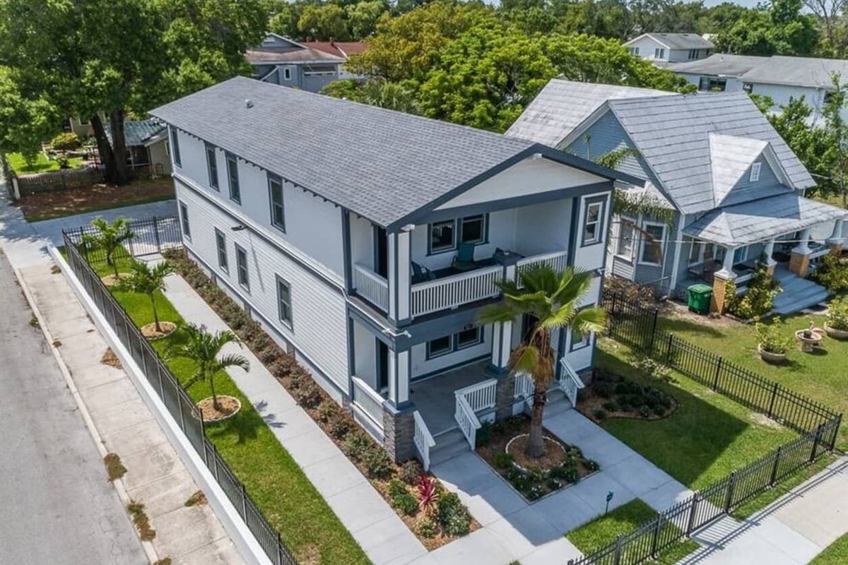 Incredible aerial front view of the house showcasing our beautiful front yard with trees and cute plants. If you are interested in this property, don't hesitate to send us an inquiry as soon as possible!