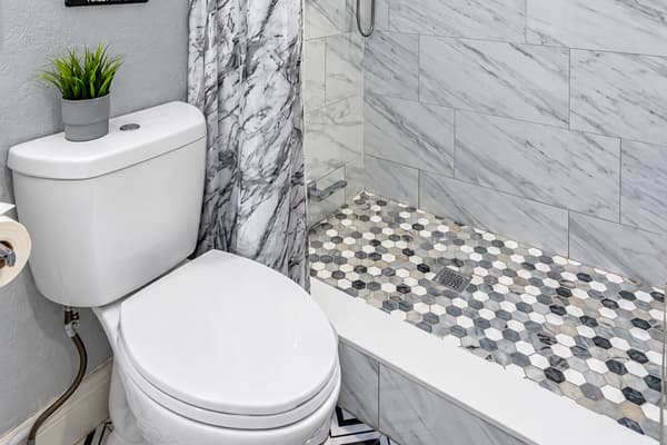 Walk-in shower, pebble-tile floor. A modern walk-in shower with a spa-like pebble floor. Rinse off the beach sand quickly and get ready for dinner. Fresh towels are waiting for you.