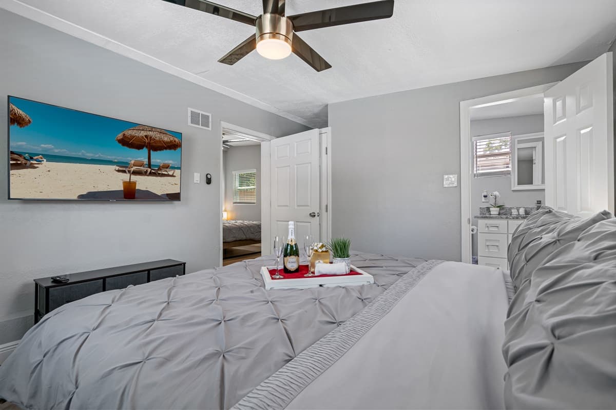 As you enter, you'll be drawn to the plush king size bed, which takes center stage in the room.