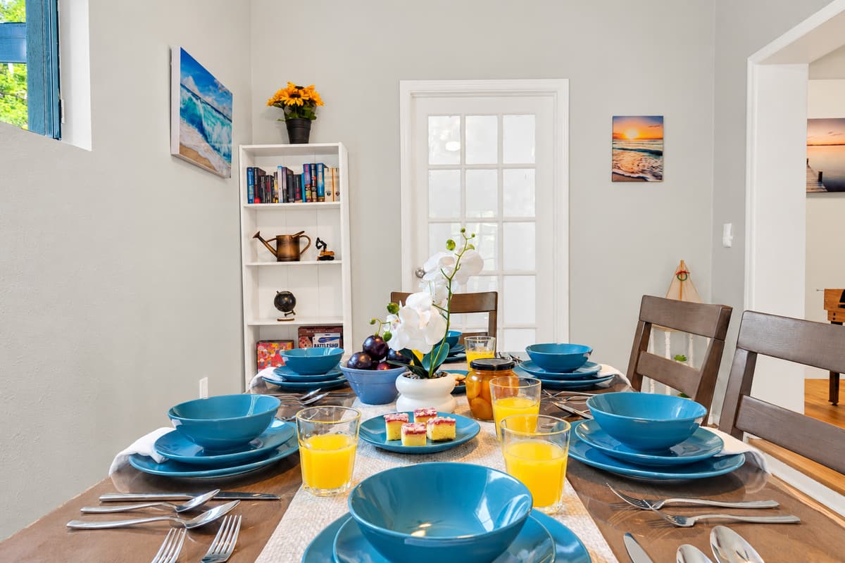 Mornings start right here: coffee, cereal, beach plans argued across the table and sunscreen somebody forgot to buy. It's the first room the house wakes up in, and the last one it settles into at the end of the day.