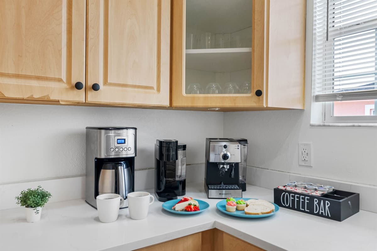 Enjoy a clean and modern cooking space with stainless steel appliances, spacious countertops, and plenty of storage.