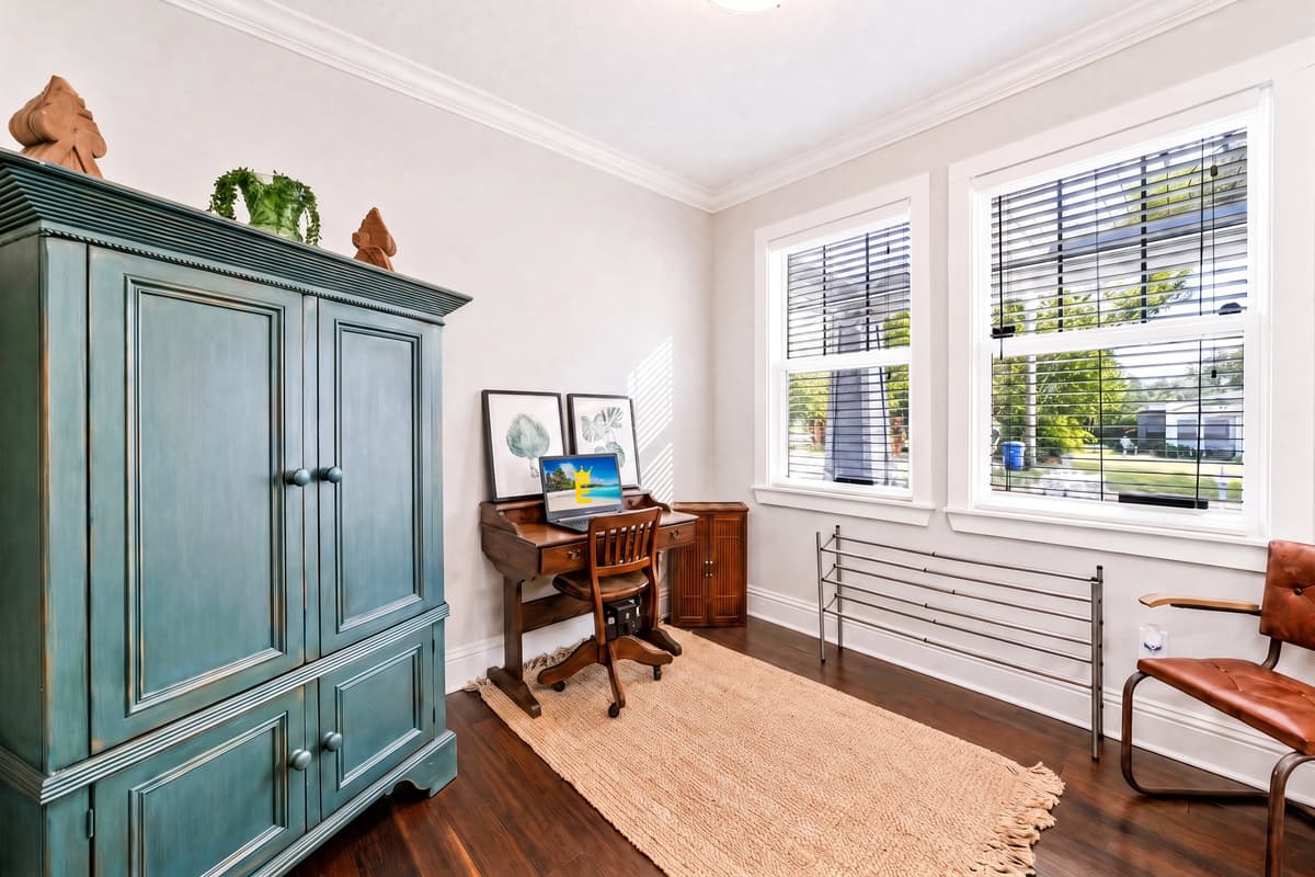 Stay productive with a dedicated workspace featuring a desk, ample natural light, and plenty of room to focus.