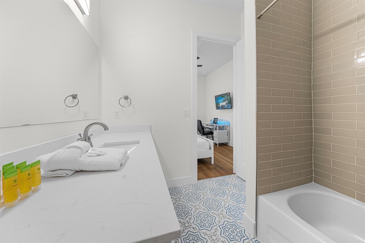 A sparkling clean bathroom stocked with essentials — step in and feel right at home from day one.
