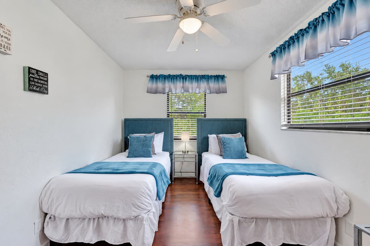 This inviting room features two cozy twin-size beds, making it perfect for accommodating guests of all ages, whether they are children, friends, or family members.