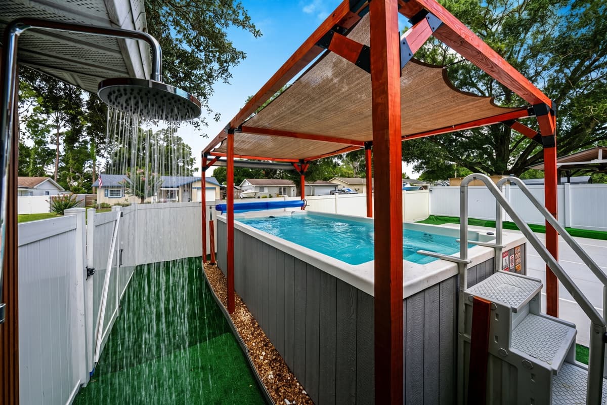Rinse off in the convenient outdoor shower before stepping into the private swim spa for the ultimate backyard retreat.