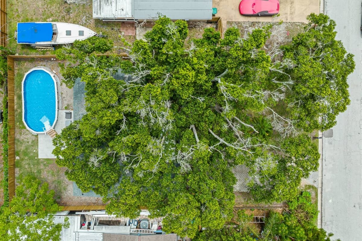 Aerial top view of our incredible house showcasing the beautiful swimming pool!