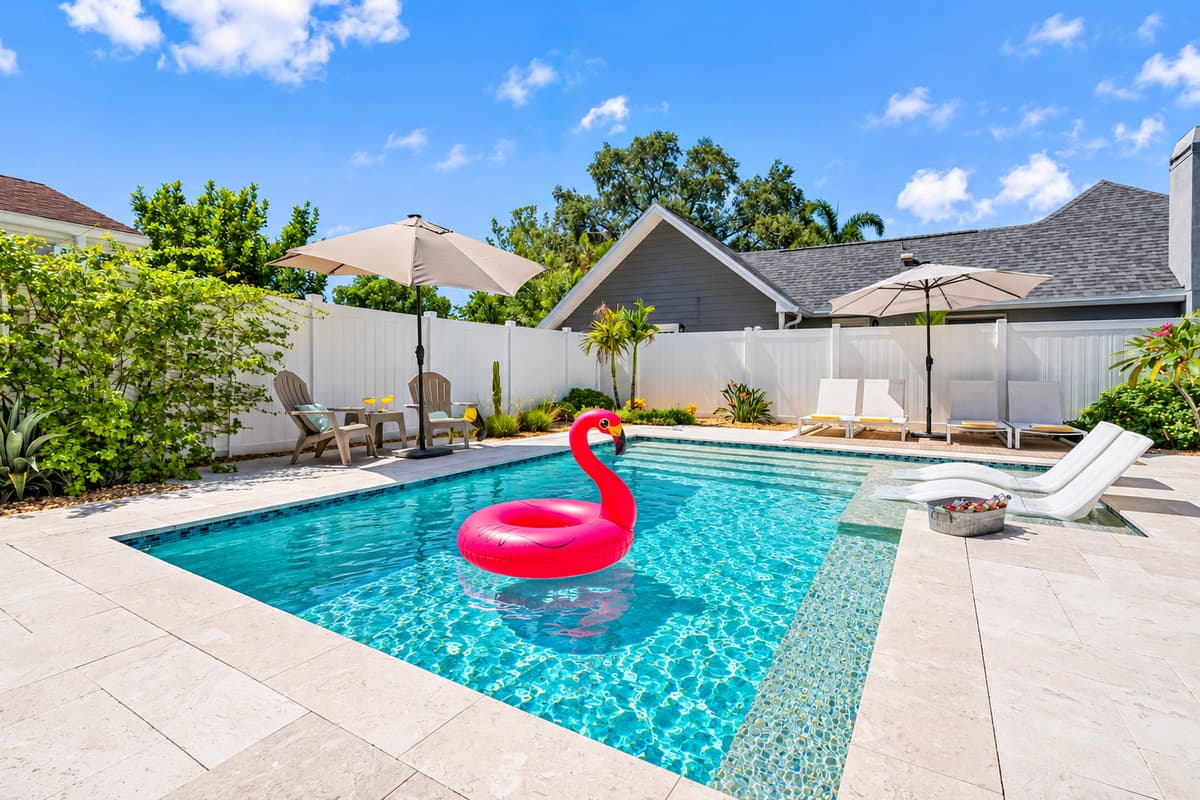 The modern rectangular pool with shallow tanning shelf and comfy loungers offers the perfect blend of style and function.