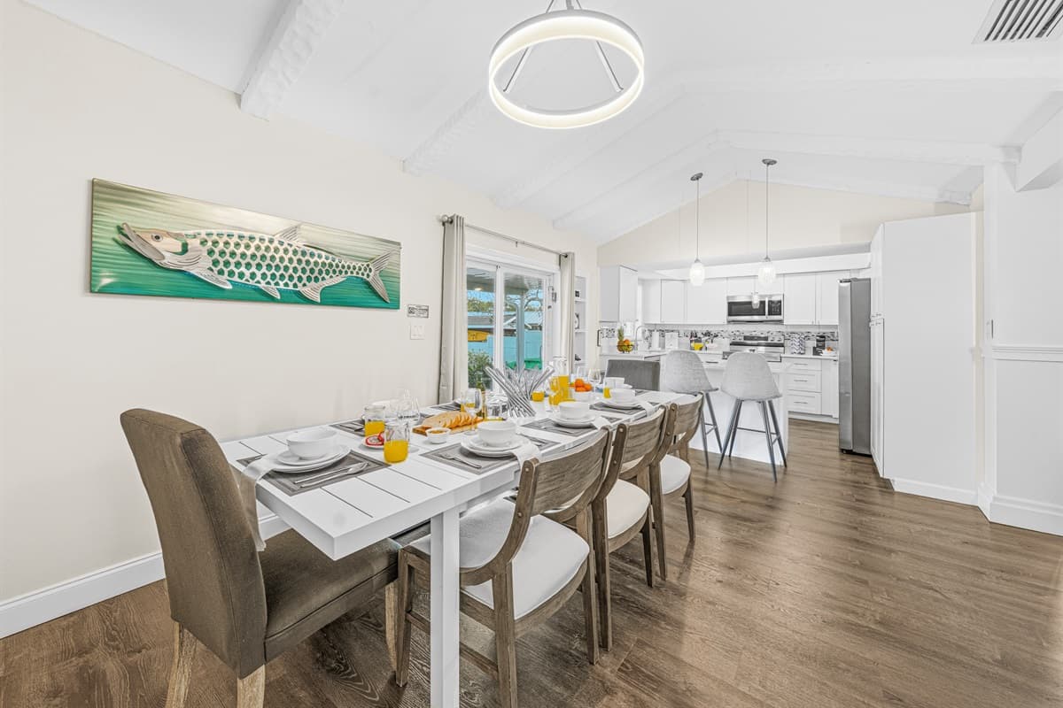 Bright dining area with an open layout connecting seamlessly to the modern kitchen.