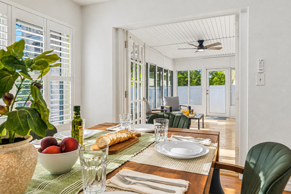 Close-up of dining table setup in a sunlit room, perfect for enjoying meals together 
Table settings and food are for staging purposes only and are not included.