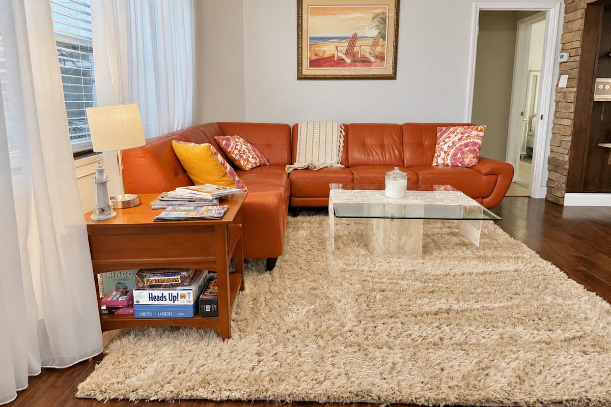 Sunlight pours through large windows, creating a bright and tranquil vibe in this thoughtfully designed lounging area.