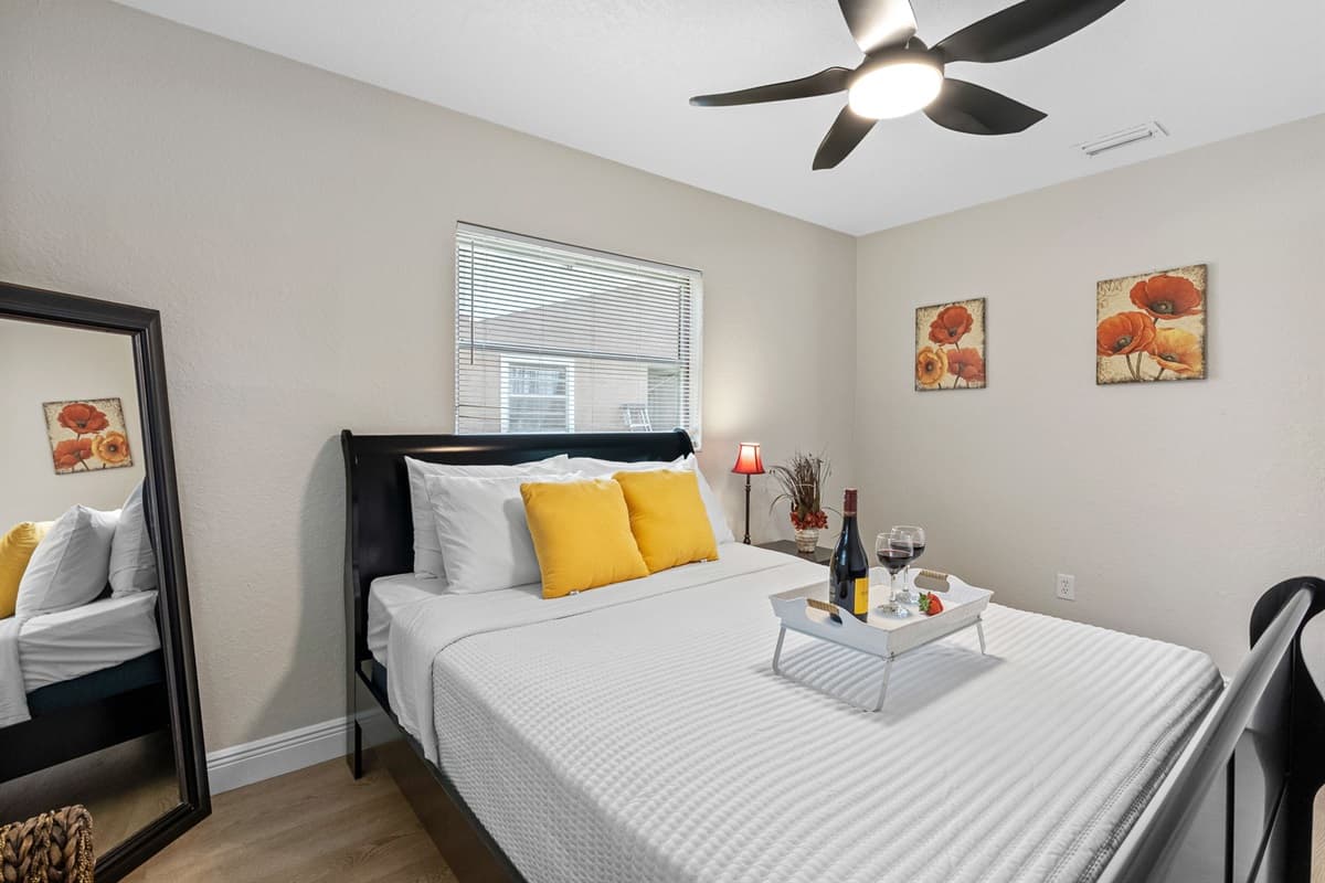 The room features soft beige walls, light wood flooring, and white trim, creating a calm and neutral backdrop that enhances relaxation.