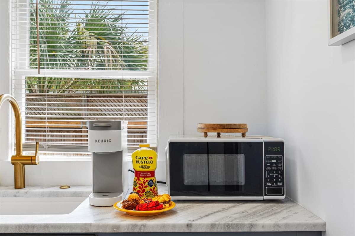 The sleek countertops provide ample space for meal prep, allowing you to easily organize ingredients, chop, slice, and prepare your favorite dishes.