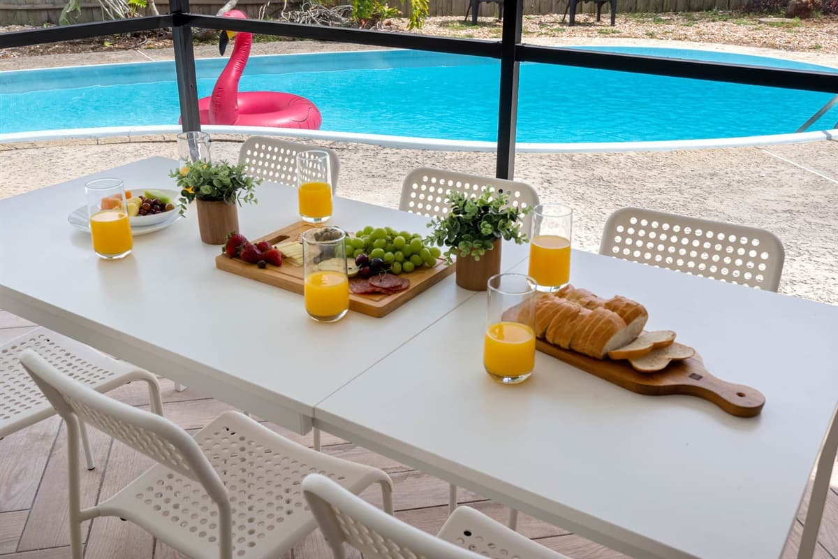 Whether you’re sipping morning coffee or lounging after a swim, the cozy textures and stylish furnishings create the perfect vibe.