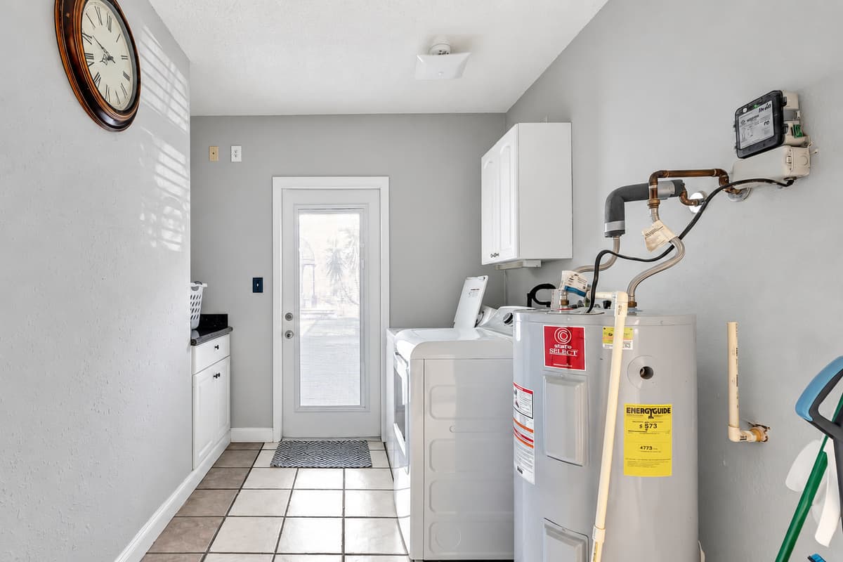 Streamline your routine in this sleek and organized laundry space – because clean clothes should come with a side of convenience.