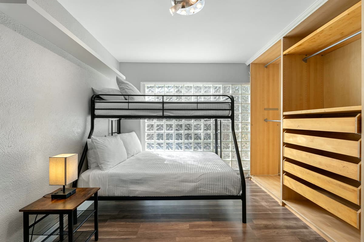 The adjoining bunk area makes this master suite ideal for parents with kids or close friends.