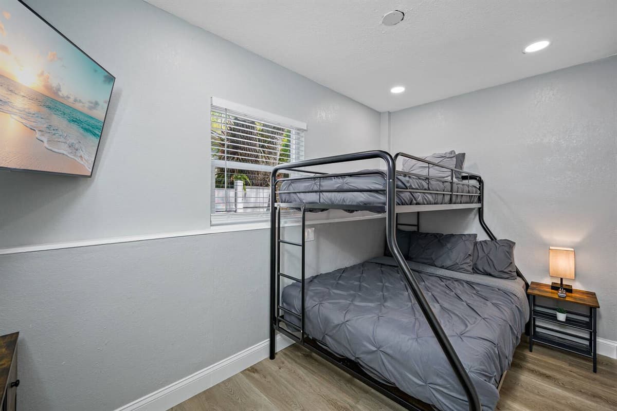 This beautiful room has a single over twin bunkbed, drawers for storage, and its own smart TV!