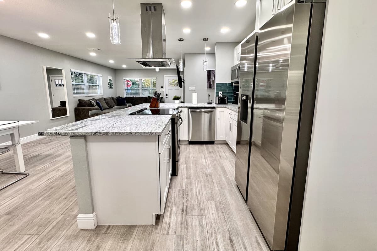 The fully equipped kitchen, boasting brand-new stainless-steel appliances that are as sleek as they are efficient.