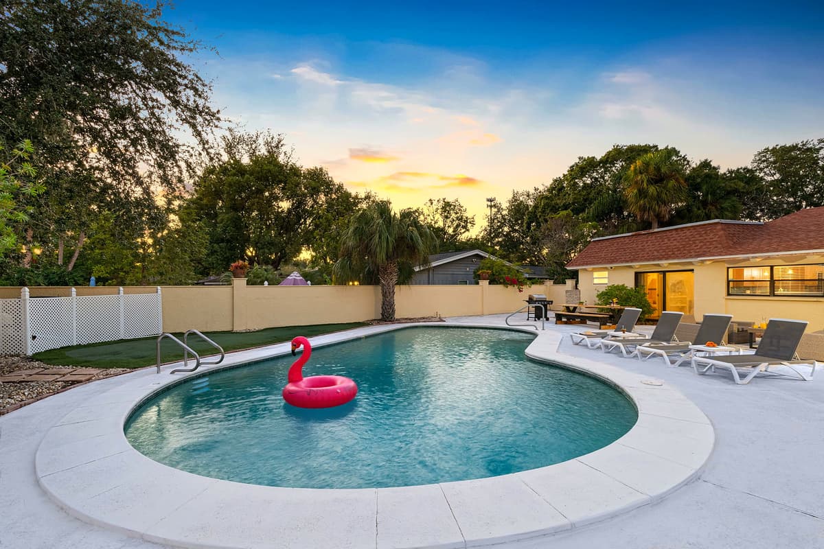 As the sun sets, the pool lights up for a cozy evening vibe — enjoy a quiet swim or sip wine under the glowing sky.