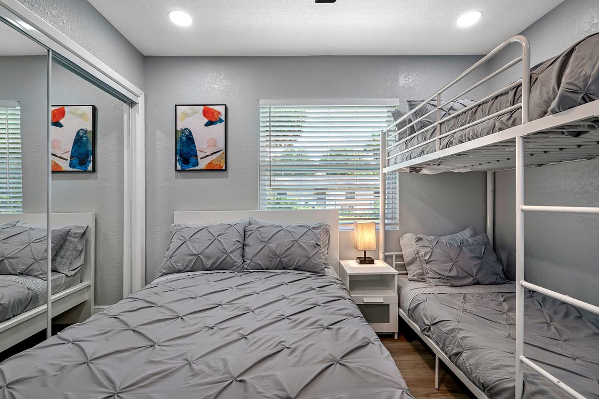Kids will sure love this elegant bedroom for sleepovers! It has a queen sized bed, single bunkbed, drawers, and a smart TV!