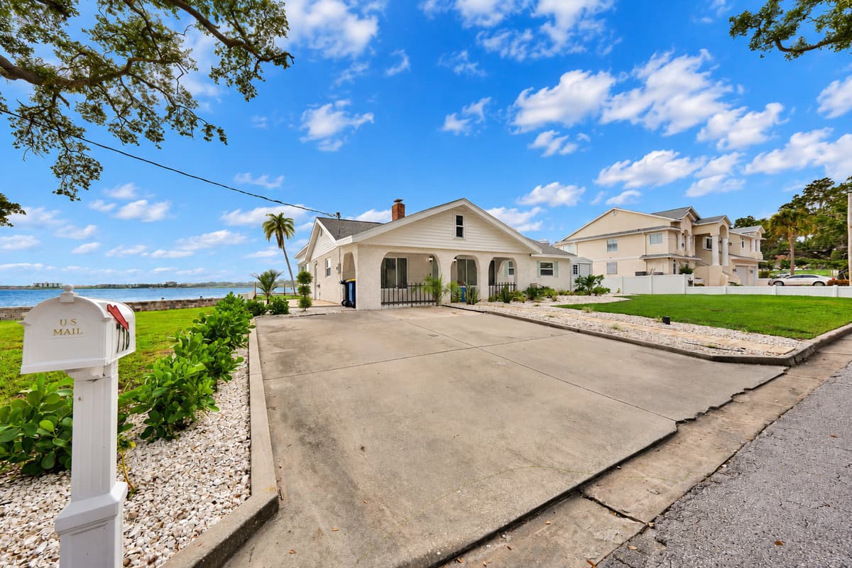 Driveway parking with a water view. Pull into the driveway and see the bay just past the house. Plenty of space to park and unload without hassle.