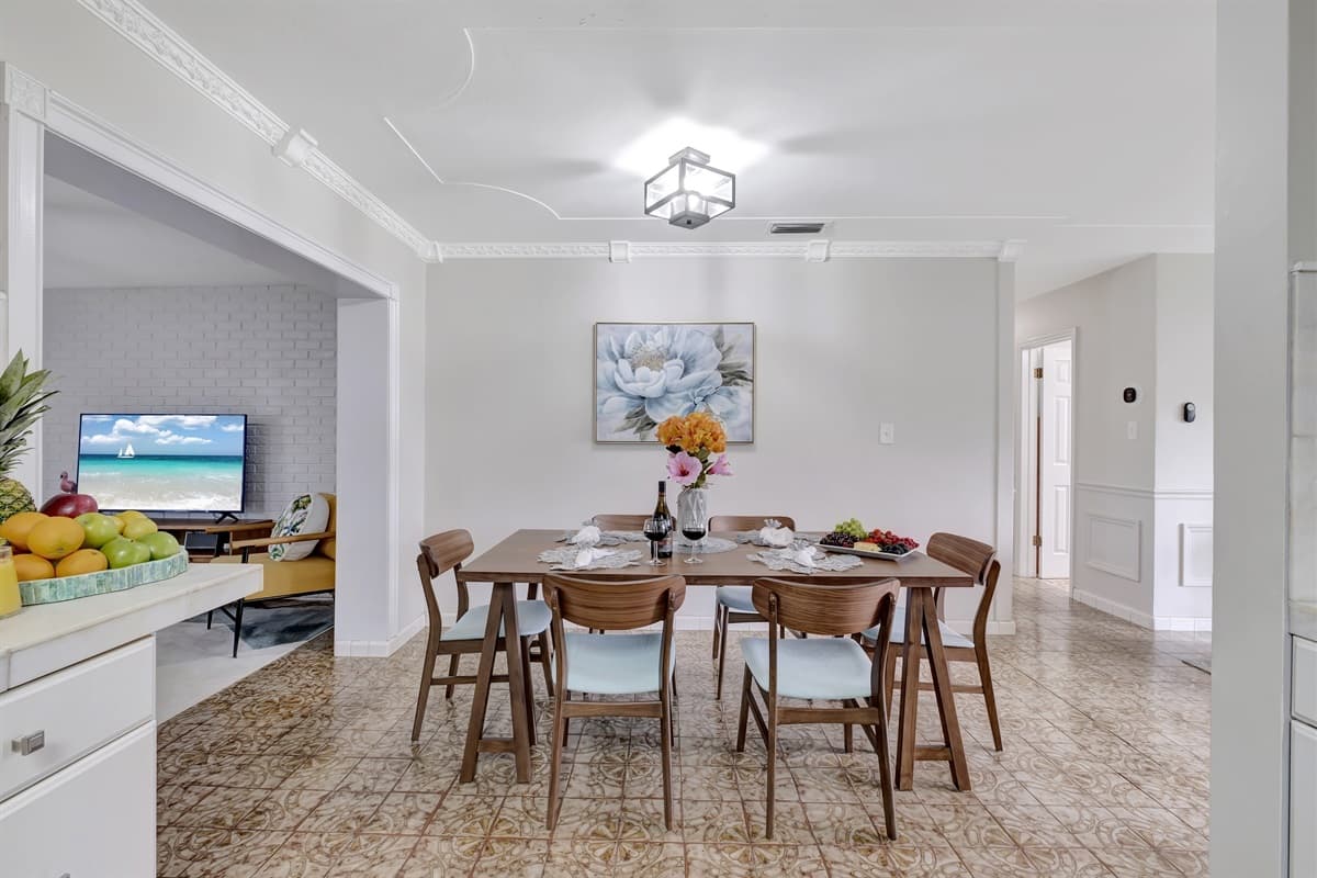 The rich wood of the table adds warmth and character to the room, making every meal feel like a special occasion.