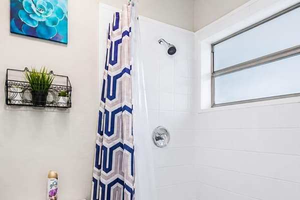 Lovely sparkling clean bathroom that has this beautiful walk-in shower, clean and fresh smelling toilet, sinks and drawers. Feel at home in your home away from home. Send us an inquiry as soon as possible!