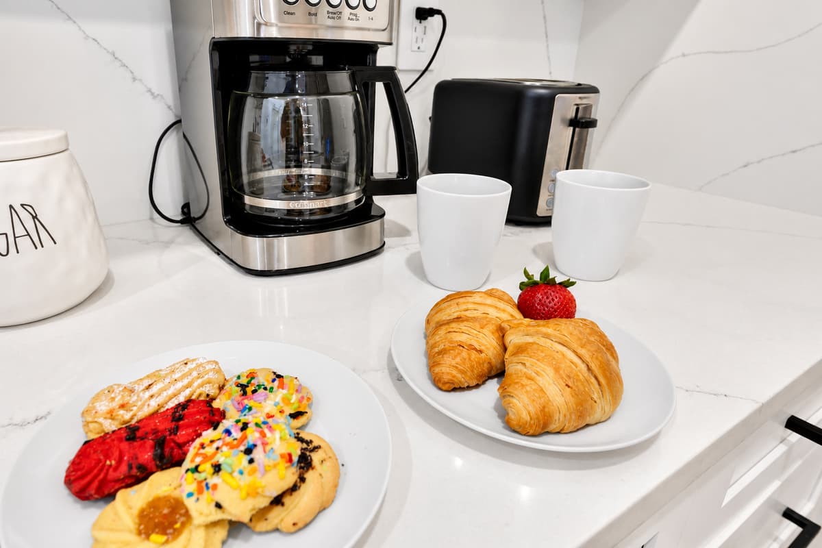 Coffee is ready before anyone else is awake. Grinder, machine and mugs already set out, with something sweet on the counter. Pour a cup, take it out to the lanai, and have the pool to yourself.