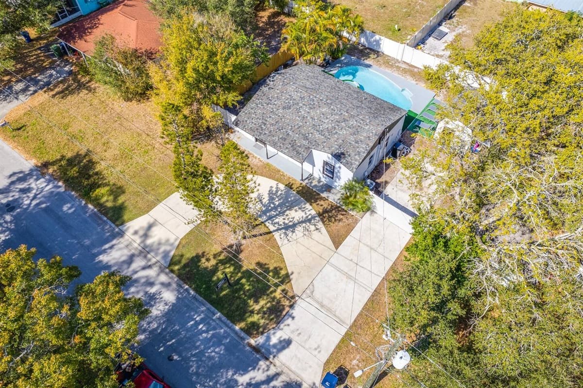 Aerial front view of the house showcasing the lovely driveway where you can park