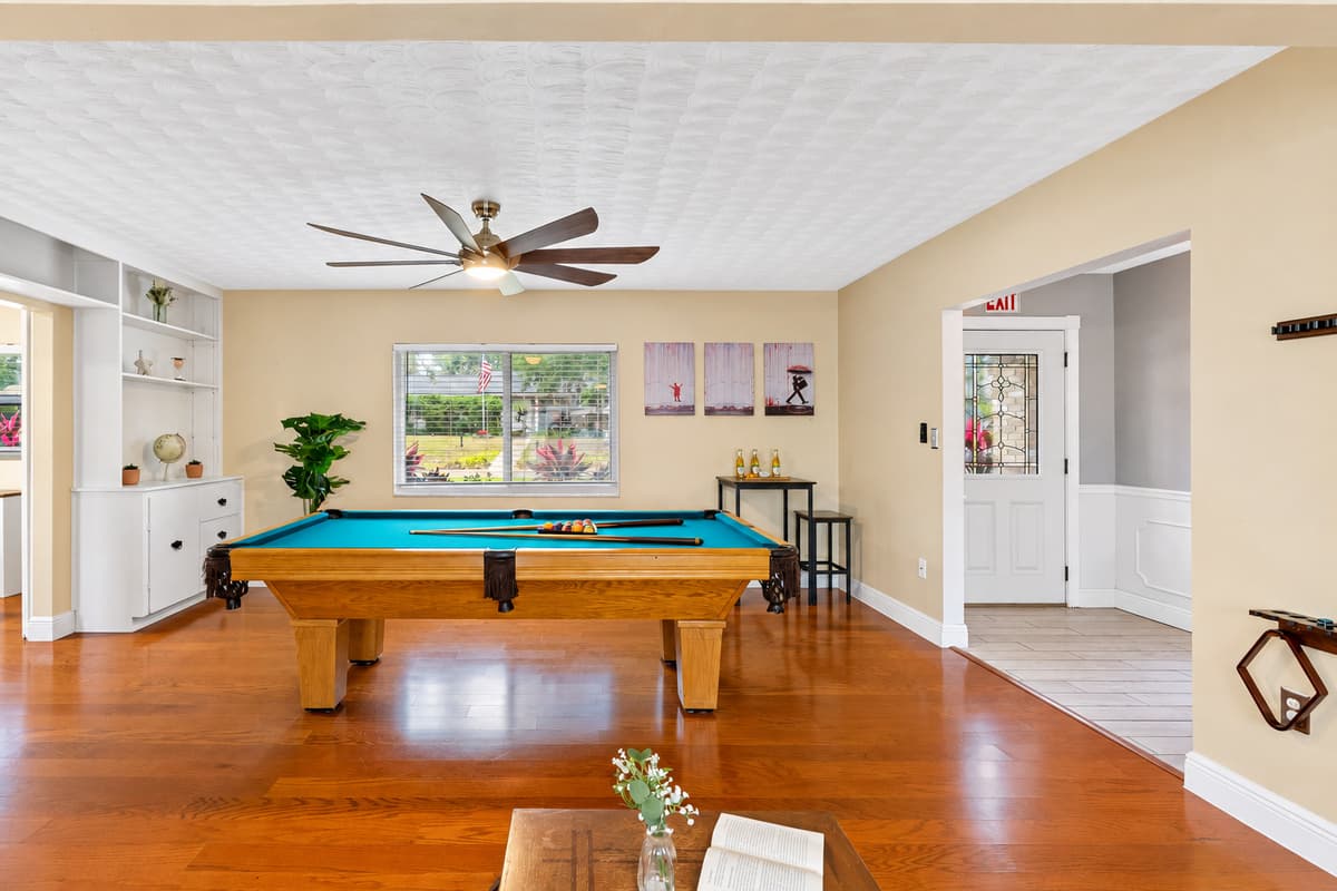 A dedicated game area with a full-size pool table and plenty of room to play.