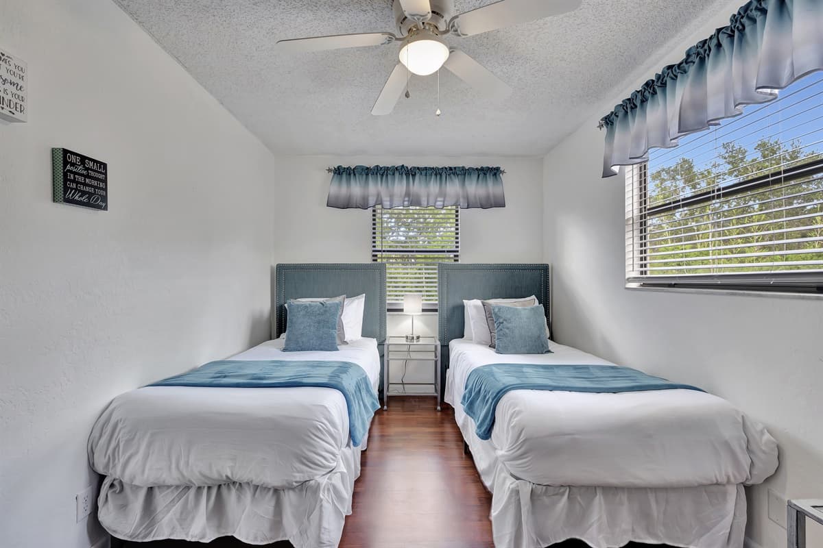 This inviting room features two cozy twin-size beds, making it perfect for accommodating guests of all ages, whether they are children, friends, or family members.