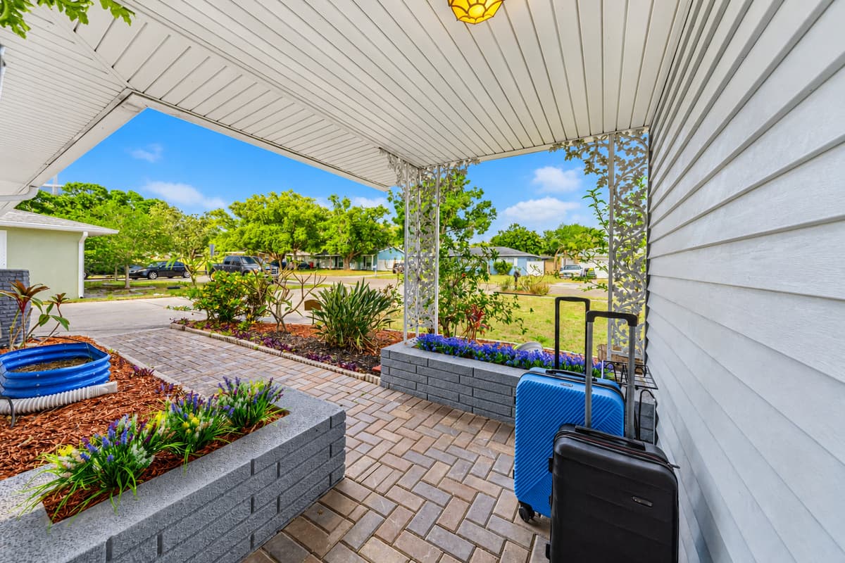 Side entrance walkway with clean landscaping and easy access to the home 