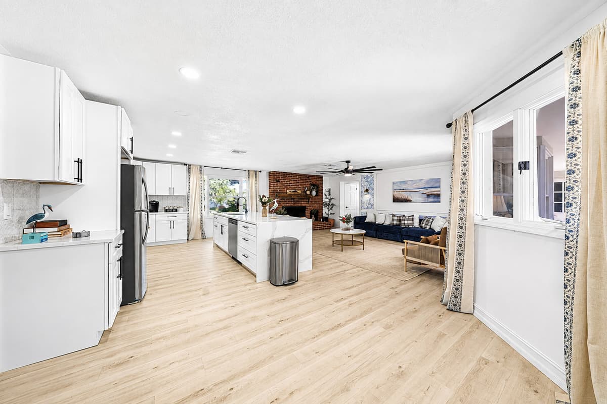 Kitchen to living room in a straight line. Start the coffee, keep an eye on the kids, never leave the conversation.