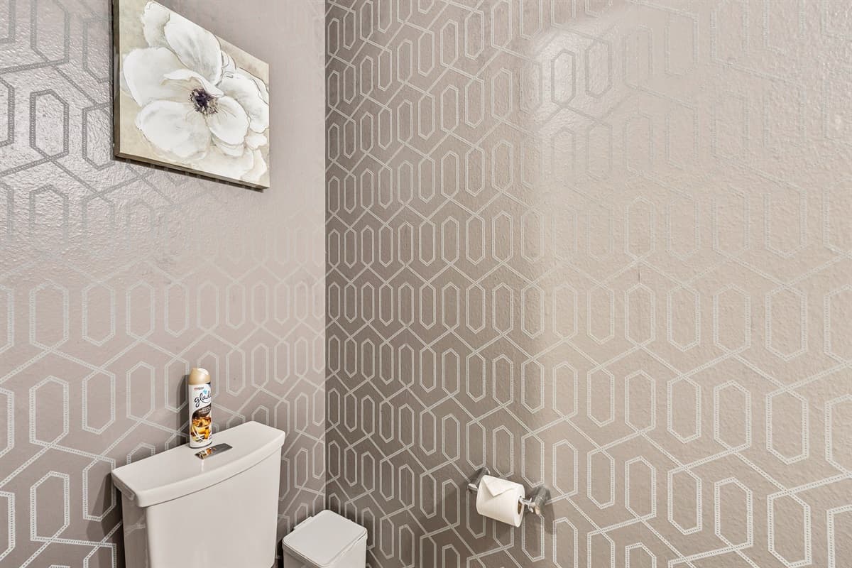 Despite its compact size, this half bathroom does not compromise on comfort or style.