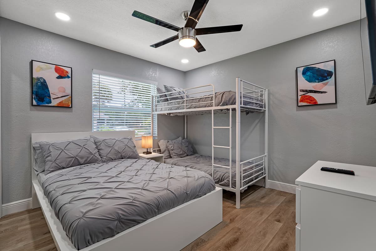 Have friends joining you on this getaway, this beautiful bedroom is perfect for them! It has a queen sized bed, single bunkbed, drawers, and a smart TV! Send us an inquiry!
