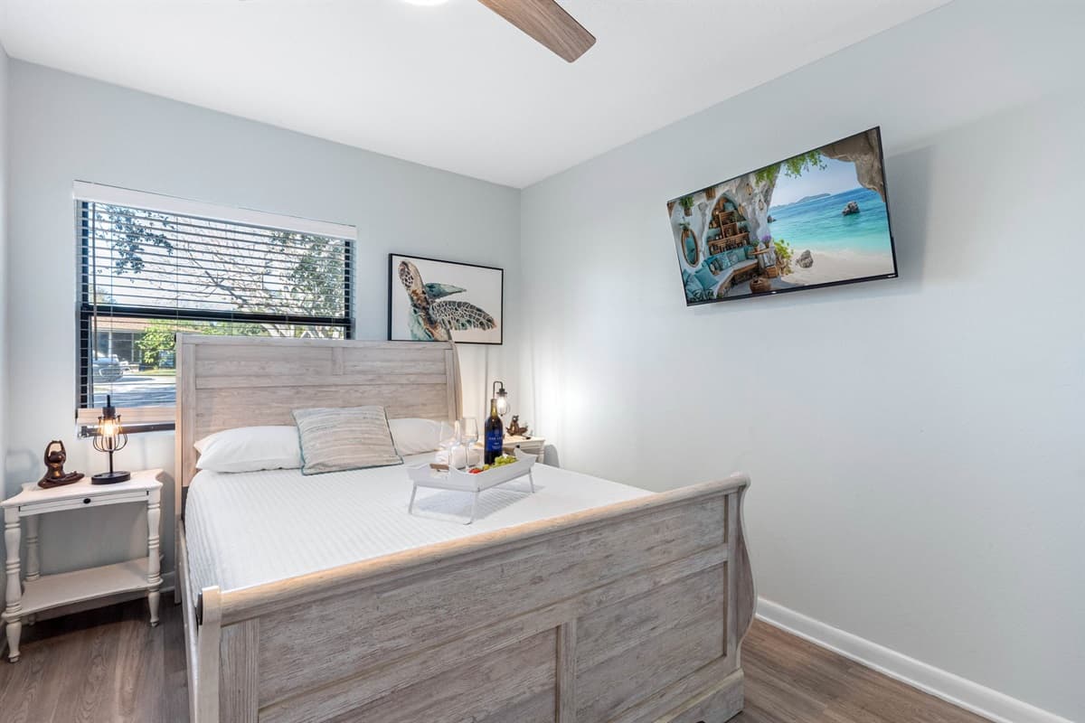 A bedside table with a stylish lamp offers convenient lighting for nighttime reading, while a spacious dresser and closet provide ample storage for personal belongings.