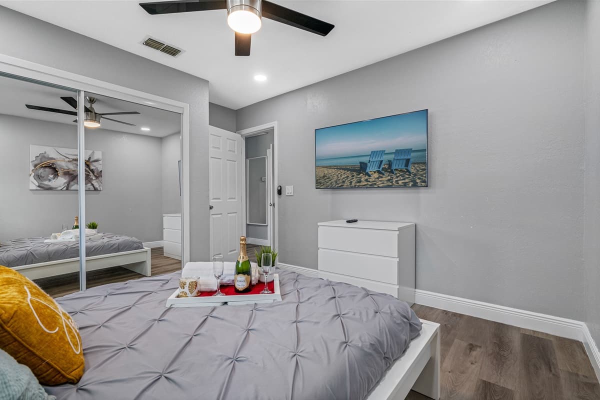 Enjoy the comfort while staying at your home far from home. This lovely bedroom has a queen size bed, smart TV, drawers and a full sized mirror closet..