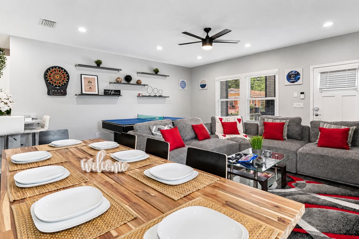 Cozy living and dining area with smart TV and ping pong table you can enjoy with family and friends. Send us an inquiry now!