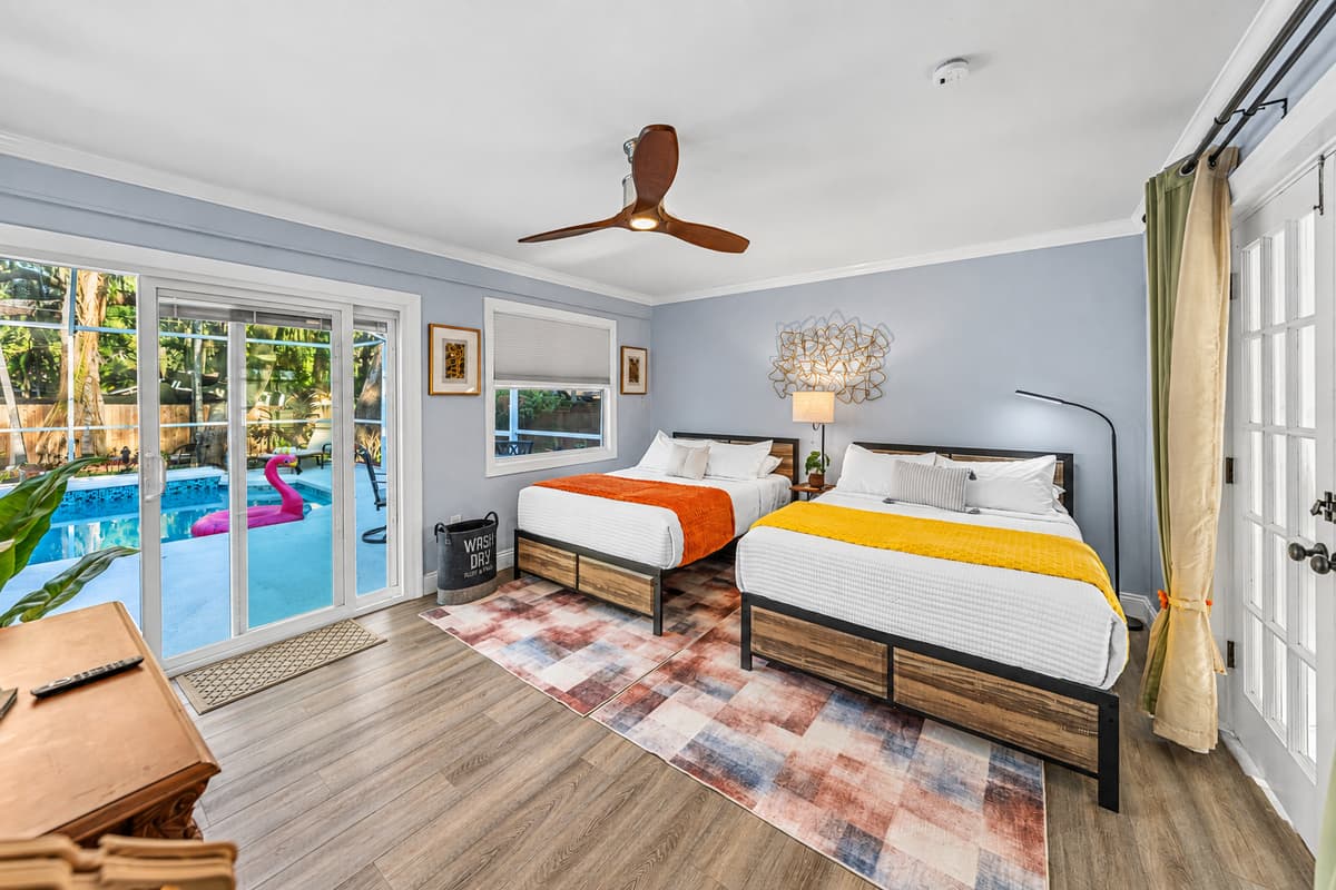 This spacious bedroom features two comfortable double beds, making it ideal for families, kids, or friends traveling together.