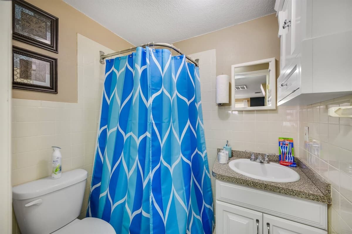 Amazing bathroom with toilet, sink, bathtub, and shower. Feel fresh and clean after a long day of travel from your home to your home away from home. If you are interested in this property, send us an inquiry now!