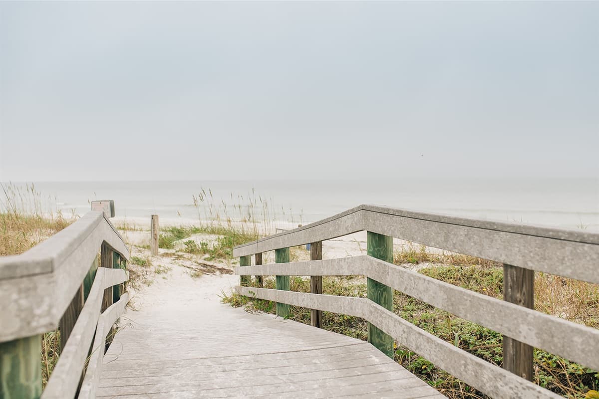A few short steps separate you from the sun-drenched sands and the soothing symphony of the ocean.