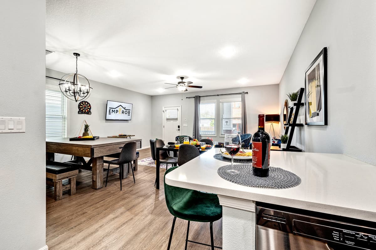 As you move through the kitchen, you'll discover an inviting dining area, seamlessly connected to the cooking space.