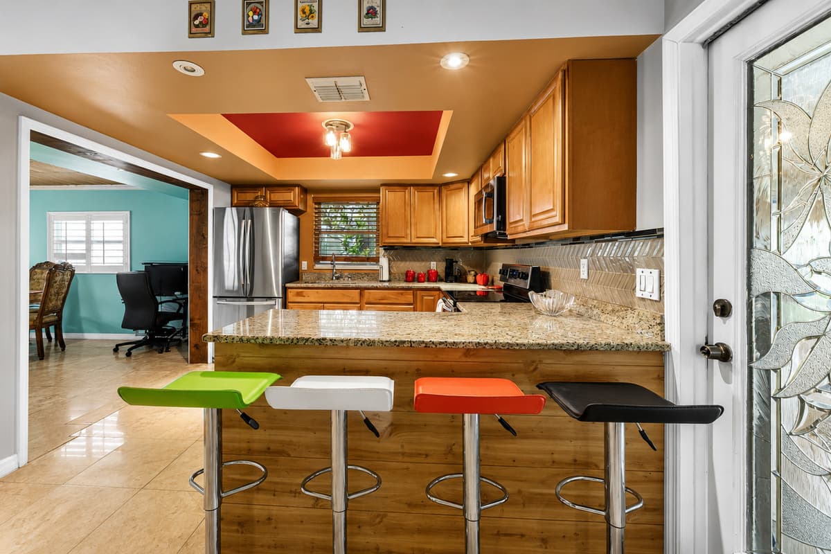 Casual dining area with bar stools, perfect for morning coffee or quick meals.